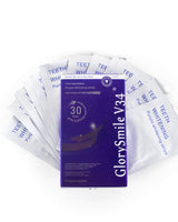 Pack of GlorySmile V34 teeth whitening strips on a white background